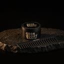 ENERGY WAX + KAMM: Don Quiff Energy Wax und Kamm auf dunklem Stein