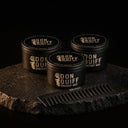ENERGY WAX 3er Set: 3 Don Quiff Energy Wax und Kamm auf dunklem Stein